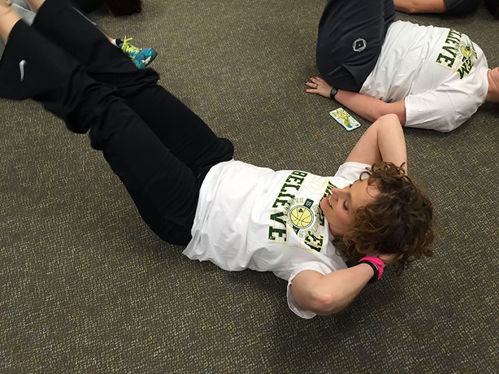 English teacher Sarah Gibbs performs crunches during a passing period at Westfield High School. (Photo by Anna Skinner)