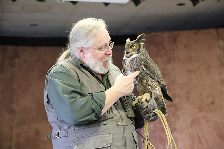 Mark Booth shows an owl during the 2015 Birds of Prey presentation. (Photo by Ann Marie Shambaugh)