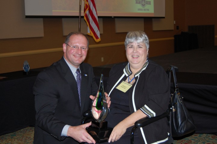 Indiana State Bar Association immediate past president Jeff R. Hawkins recognizes Donna J. Bays for excellence in the area of family law. (Submitted photo)