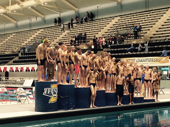 Carmel celebrates its first place finish at the boys state high school swimming meet. (Photo by Mark Ambrogi)