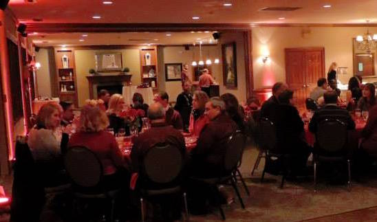 Sweethearts enjoy the evening during last year’s “Paint the Town Red” Valentine’s Day dinner at River Glen Country Club. (Submitted photo)