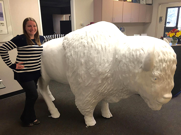 Heather Davis poses with one of the 5-foot fiberglass bison. (Submitted photo)