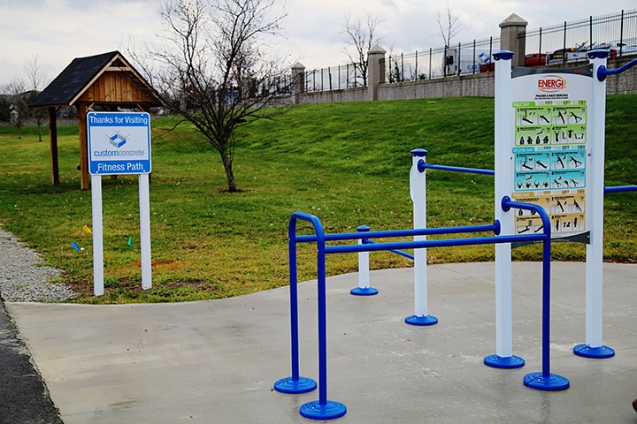 Custom Concrete installed fitness equipment on the Monon Trail last year. (File photo)