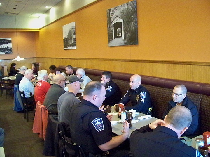 Officers with the Fishers Police Dept. met with members of the public during the department’s Coffee with a Cop event Feb. 19 at Sunrise Café, providing an informal setting for officers to be available to sit down and speak with citizens on issues and things important to them. (Photo by Sam Elliott)