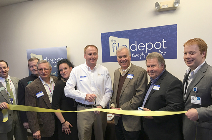 The File Depot held a grand opening ceremony and ribbon cutting March 2 at the new franchise, 17406 Tiller Ct. #300. File Depot offers documentation storage, digitizing, organization, shredding and other services. For more, visit www.thefiledepot.com. From left, Steve Rupp, Steve Benedict, Jim Ake, Denise Rush, Owner Scott Rush, Mayor Andy Cook, A.G. Crowe and Tom Dooley. (Submitted photo)