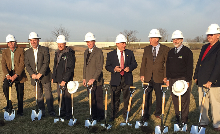 From left: Mark Keen, Duane Lutz, Steve Hoover, Chuck Lehman, Jim Ake, Mayor Andy Cook, Robert Horkay and Joe Edwards participated in the groundbreaking for the new outpatient care center. (Photo by Anna Skinner)