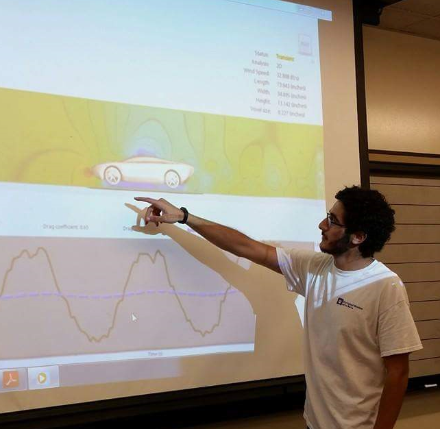 Ghassan Zalem explains aerodynamic principals and results from a wind tunnel simulation. (Submitted photo)