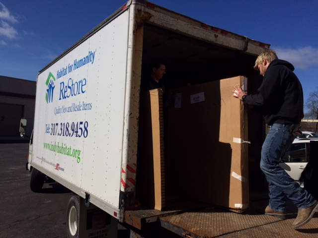 Kyle Morrison of Renewal by Anderson in Carmel unloads a delivery for a ReStore project. (Submitted photo)