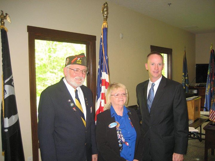 VFW Indiana State Commander Buzz Weberding, left, and Sharron Barger, VFW Auxiliary president for the state of Indiana, recognize Carmel High School teacher Will Ellery. (Photo by Ray Compton)