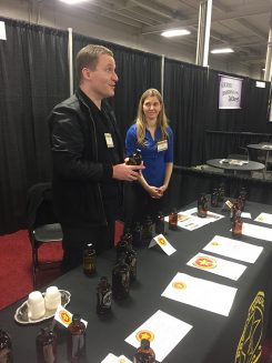 Nick Murdick, left, speaks to customers about his kombucha teas. (Submitted photos)