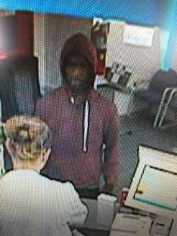 Fishers Police Dept. investigators are asking anyone who recognizes the suspect from an armed robbery of the CVS Pharmacy on 116t Street to call 317-595-3300. (Submitted photo) 
