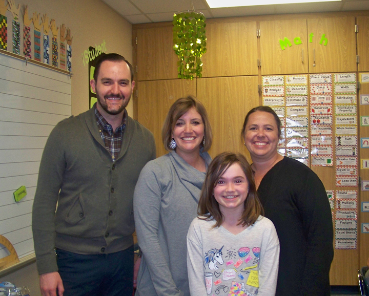 Market District’s Jason Riley presented store gift cards to Fall Creek Elementary third grade teachers Ailee Howard and Amy Schank and brought a pizza party lunch to their class after they were nominated for Teacher of the Month honors by student Katherine McGuire.