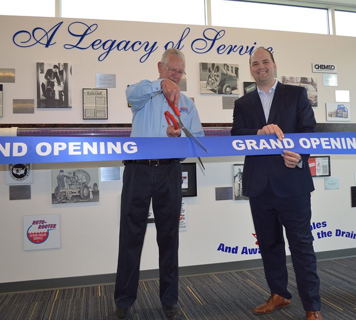 Roto-Rooter General Manager Hal Glenn cuts the grand- opening ribbon held by Fishers Mayor Scott Fadness at Roto-Rooter’s new service facility in Fishers. (Submitted photos)