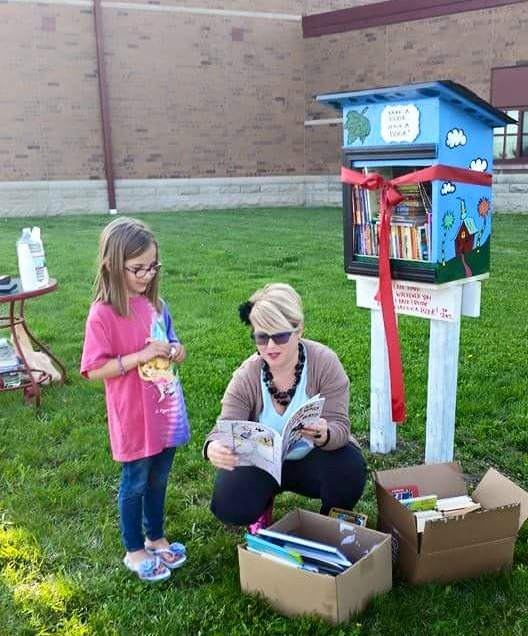 Esther Mead, right, introduces her first Itty Bitty Library to Dani Ginder. (Submitted photo)