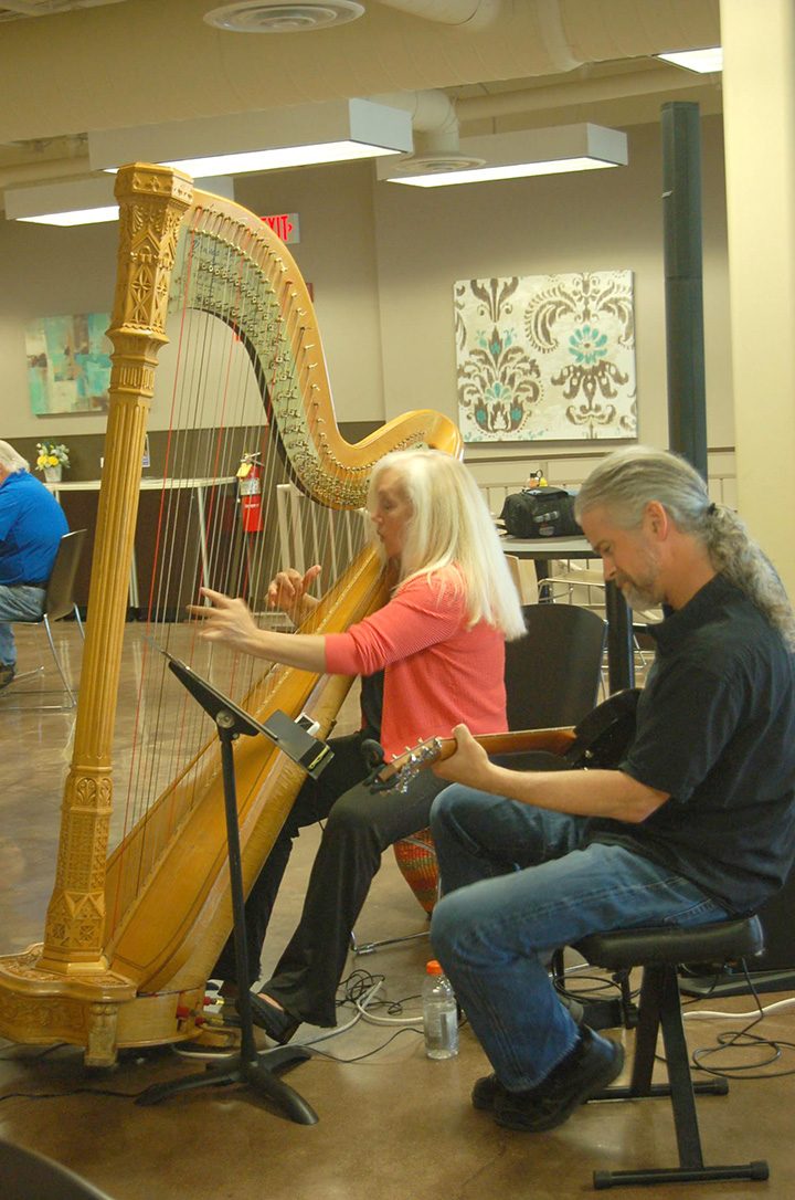 Harpist Jan Aldridge-Clark, left, and guitarist Casey Harshbarger, perform during lunch at the Carmel Kroger. (Photo by Heather Lusk)
