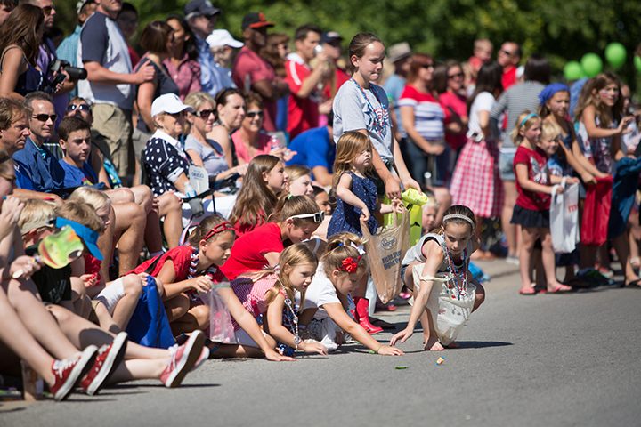 Children collect candy during last year's CarmelFest parade. (Submitted photo.)