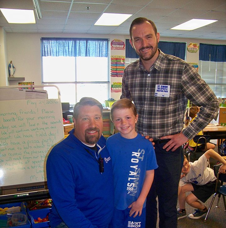 Pictured, from left, St. Simon the Apostle second-grade teacher Brian Krause was nominated as Teacher of the Month by student Andrew Taylor, earning his class a pizza party and Krause a gift card delivered by Teacher of the Month sponsor Market District’s Jason Riley. (Photo by Sam Elliott)