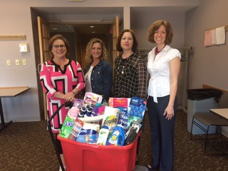 From left, Debbie Driskell, Stacy Puls, Jan McCrory and Heather Willman from the Fall Creek and Delaware Township offices and pantries, show off some of the personal care items donated during the Make it Personal Drive, which was conducted by the Fishers City Government Academy Alumni Group. (Submit- ted photo)