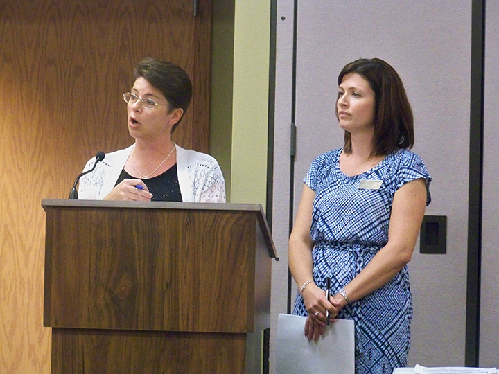 Hamilton Southeastern Schools Business Manager Cecilie Nunn, left, and Food Services Director Andrea Ray address the school board during its May 25 meeting. (Photo by Sam Elliott)