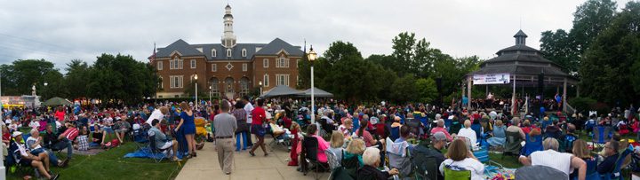 Visitors gather near the Gazebo Stage and listen to the Carmel Symphony Orchestra. The Gazebo Stage was sponsored by Geico. (Photo by Jason Conerly)