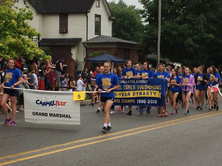 The Carmel High School girls swimming team served as the Grand Marshal due to its 30-year dynasty state championship. (Photo by Anna Skinner)