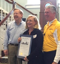 Peggy Powell, center, pauses with Carmel Mayor Jim Brainard, left, and CarmelFest Chairman Gary Sexton as she receives her award. (Submitted photo)
