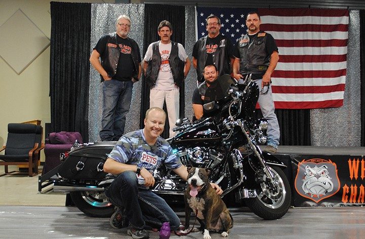 Back, from left, Wheel Dawgz Members Bill Shepard, Norm Taylor, Randy Graham, Jim Flynn. Middle, President Justin Boes. Front, from left, Justin Growden, a veteran, and Princess. (File photo by Anna Skinner)