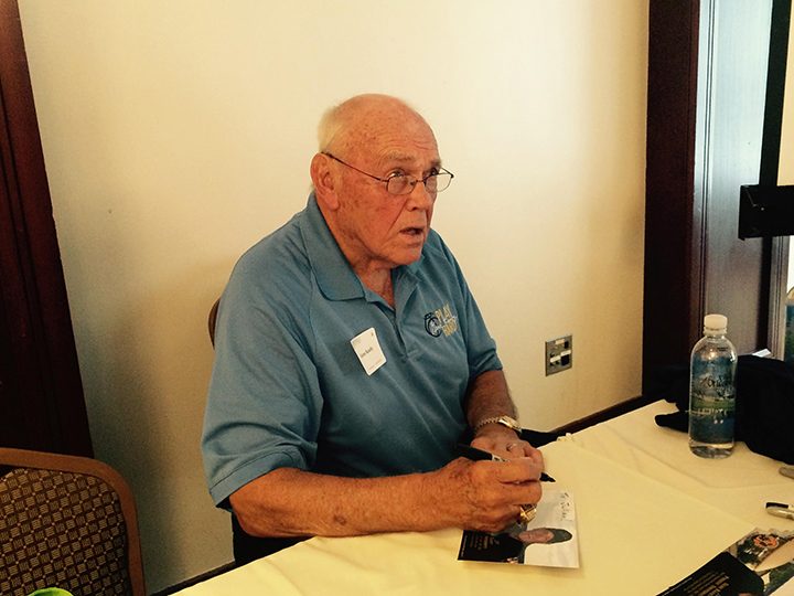 Gene Keady signs autographs at the Westfield Chamber of Commerce luncheon July 21. (Photo by Mark Ambrogi)
