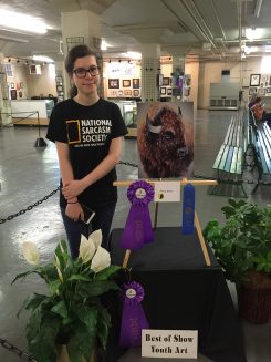 Mary Kane with her award-winning painting of a bison. (Submitted photo)