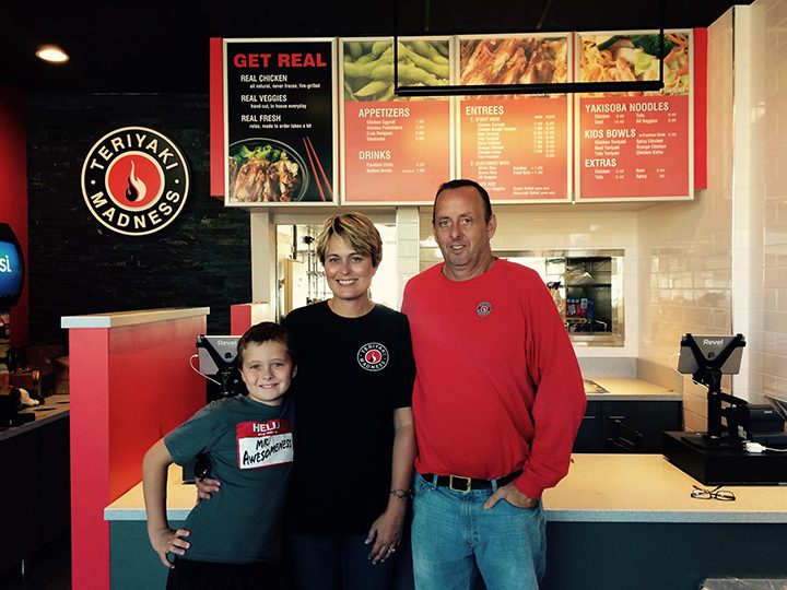 From left: John, Janna and Trevor Sweeney in front of their Teriyaki Madness counter. (Submitted photo)