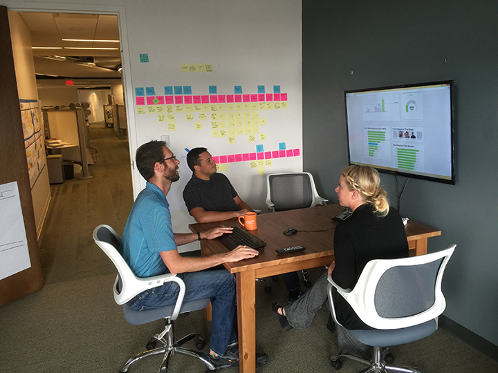 SEP team members Jon Fuller, Kelly Wilson and Matt Loria evaluate their company’s H2W dashboard. (Photo by Ryan Schade)
