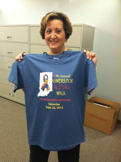 Patty Reed displays an Answers for Autism Walk T-shirt. (Submitted photo)