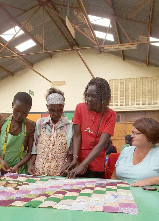 From left, Kenyan women Beatrice, Emily and Penny learn from Lynn Summers during an Imani Workshop. (Submitted photo)