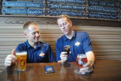 From left, Steve Williams, Tasting Society Marketplace director, and Justin Knepp, Indiana on Tap founder, discuss the new Indiana on Tap app, which launched Aug. 17. (Photo by Anna Skinner)