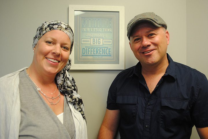 Matt and Cari Hahn pause next to a motivational sign in Cari’s office. (Photos by Anna Skinner)