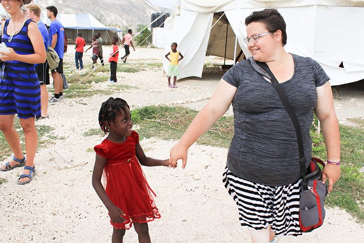 Allison Mayer, right, plays with a girl from the children’s home at Nehemiah Vision Ministries in Onaville, Haiti. (Submitted photo)