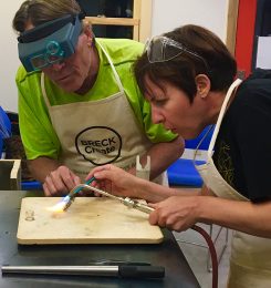 From left, Carmel jeweler Mark Grosser works with a student in Breckenridge, Colo. (Submitted photo).