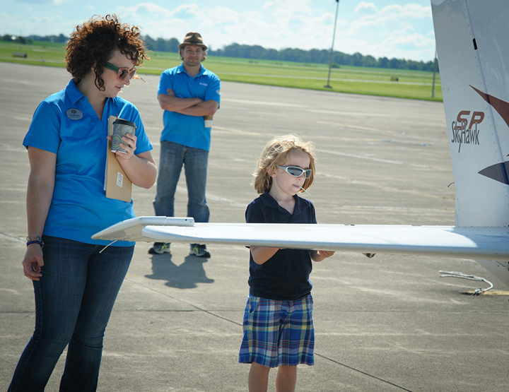 Deklan Hargett checks out an airplane wing as part of a Flight1 program as Caroline Hoy and Flight1 founder Marcus Strawhorn watch. (Submitted photos)