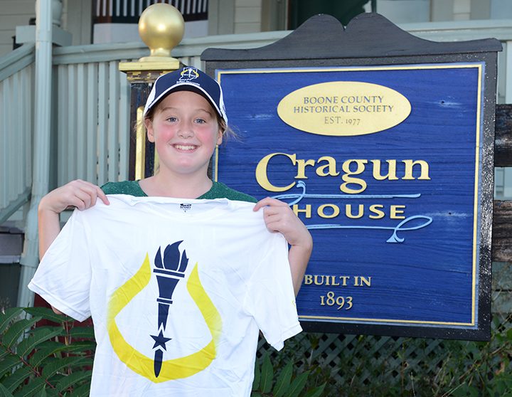 Fourth grader Audrey Mast of Zionsville displays her official torchbearer T-shirt. She is one of 11 Zionsville residents selected to carry the bicentennial torch through town. (Photos by Theresa Skutt)