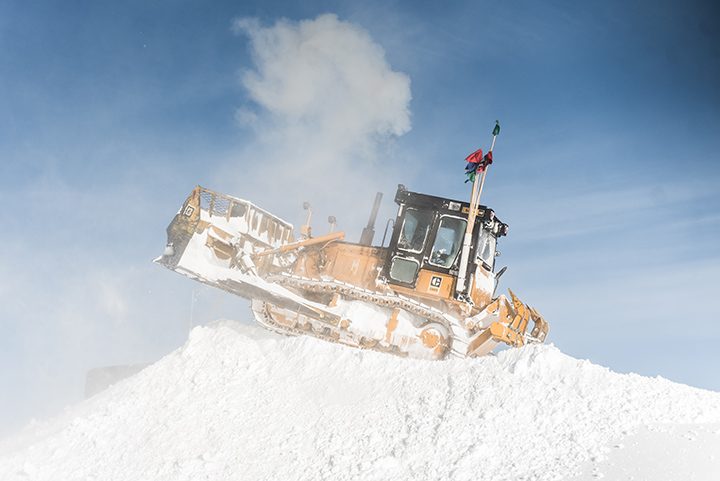 Bruce Tischbein clears snow in Antarctica in a bulldozer. (Submitted photo)