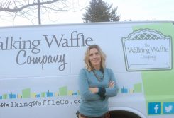 Stephanie Lewis in front of The Walking Waffle Company van. (Photo by Mark Ambrogi)