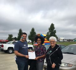 From left, Christian Brothers Automotive Fishers owner Jared Seaman presents car to Shayna Cummings along with Good Samaritan Network Executive Director Nancy Chance. (Submitted photo)