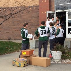 The Zionsville Community High School football team volunteers at Zionsville Food Pantry delivering and unloading food drive donations Nov. 14. (Submitted photo)