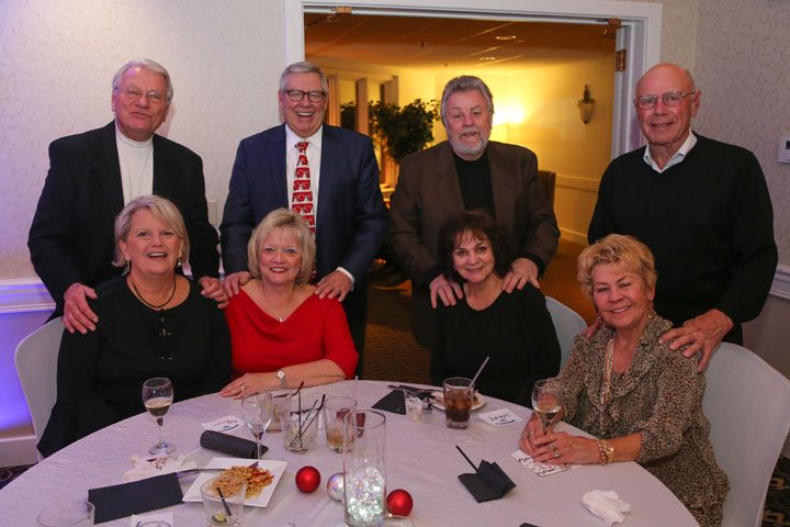 Back row, from left, Jon Bereman, Rich Locke, James Peraino, John Meservy, and front row, from left, Lynn Bereman, Joan Locke, Shirley Peraino and Kathy Meservy attend the Woodland Country Club 60th anniversary celebration. (Photo by Ann Marie Shambaugh)
