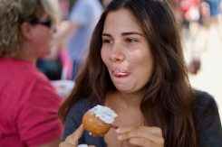 Maria Vittoria Basile tries food at the Indiana State Fair.