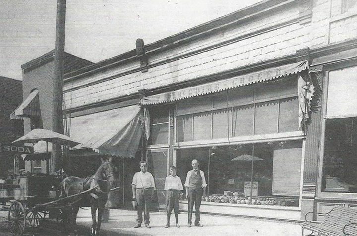 Pictured from left to right, Hom White, Emil Lowe and W.D. McGuire stand by the delivery wagon in front of McGuire’s grocery. (Submitted photo courtesy SullivanMunce Cultural Center)