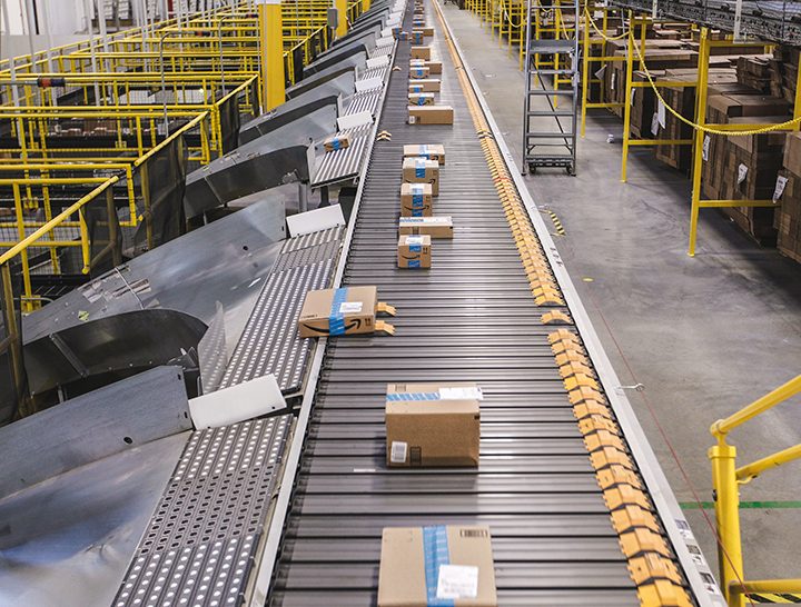 Packages travel down a conveyor belt at an Amazon Fulfillment Center. (Submitted photo)