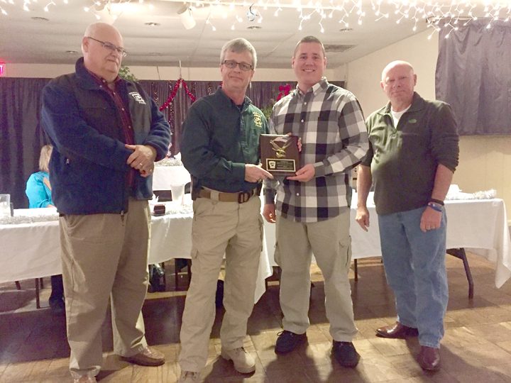 From left, ZPD Capt. Jeff Morris, Chief Robert Knox, Lt. Bryan Sauer and Capt. Robert Musgrave present Sauer with the Officer of the Year award. (Submitted photo)