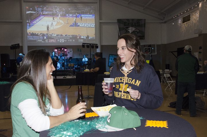 Kristin Kunttu and Jen Valentine, parents of Zionsville Middle School and Zionsville High School athletes, enjoy drinks and snacks at Eagle Madness. (Photo by Sara Baldwin)