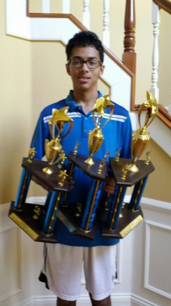 Ashwin Prasad displays his three Hamilton County Spelling Bee trophies. (Submitted photo)